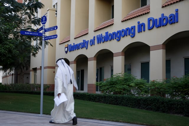 An Emirati student arrives at the building of the University of Wollongong in Dubai, United Arab Emirates, Dec. 28, 2009.