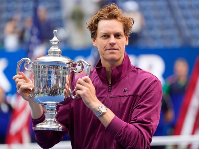 Jannik Sinner celebrates with the trophy after defeating Taylor Fritz in the men's singles final of the 2024 U.S. Open at USTA Billie Jean King National Tennis Center.