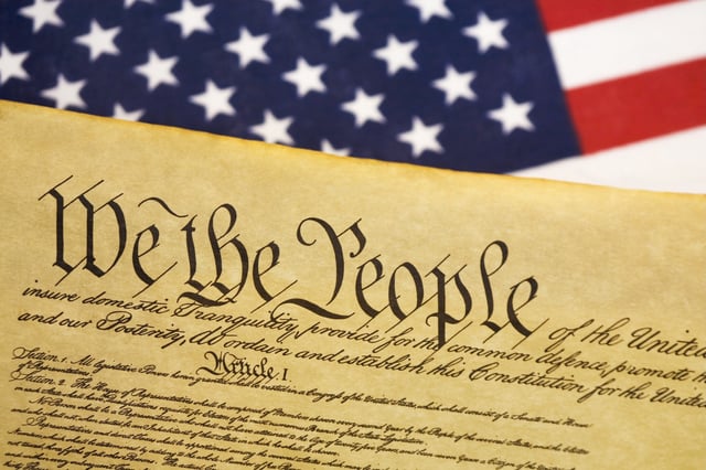 Constitution with USA flag background