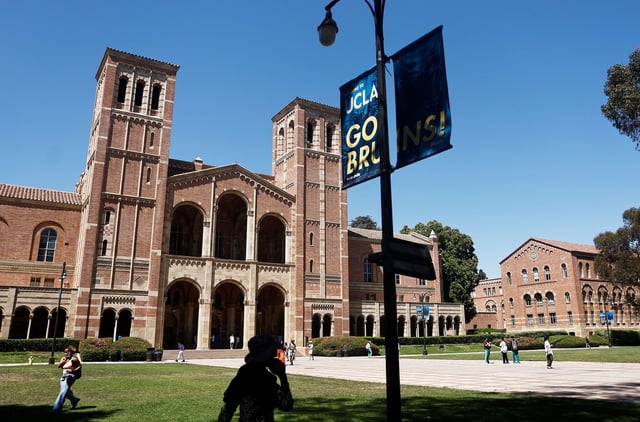 LOS ANGELES, CALIFORNIA - JULY 30: People walk on the plaza outside Royce Hall, the site of 2024 pro-Palestinian protests, on the UCLA campus on July 30, 2025 in Los Angeles, California. The University of California, Los Angeles has reached a $6 million settlement with Jewish students and a professor in a lawsuit alleging discrimination over the 2024 pro-Palestinian campus protests. (Photo by Mario Tama/Getty Images)