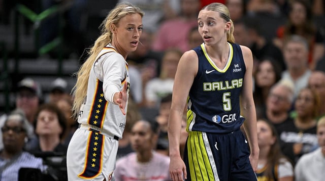 Aug 1, 2025; Dallas, Texas, USA; Dallas Wings guard Paige Bueckers (5) and Indiana Fever guard Sophie Cunningham (8) in action during the game between the Dallas Wings and the Indiana Fever at the American Airlines Center. Mandatory Credit: Jerome Miron-Imagn Images
