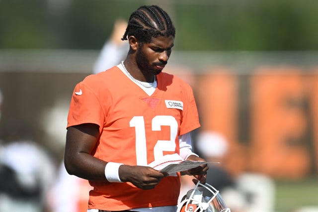 Jul 26, 2025; Berea, OH, USA; Cleveland Browns quarterback Shedeur Sanders (12) looks at a play sheet during training camp at CrossCountry Mortgage Campus. Mandatory Credit: Ken Blaze-Imagn Images/ File Photo