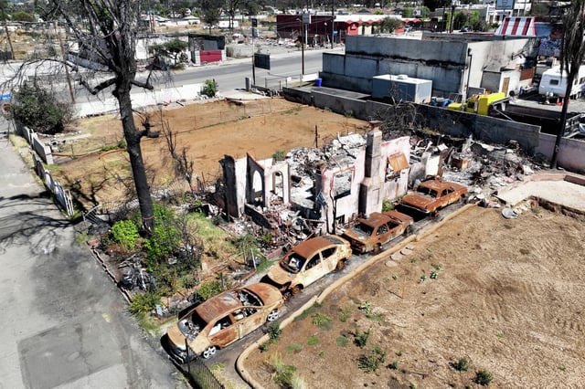 The uncleared lot where a 19th victim of the Eaton Fire was found on July 24, 2025, in Altadena, Calif., bringing the official death toll to 31 more than six months after unprecedented wildfires swept through broad swaths of Los Angeles.