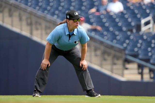 Umpire Jen Pawol takes her position during the first inning of a 2024 spring training game between the St. Louis Cardinals and Washington Nationals.