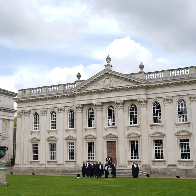 FILE - Graduating students take photos outside Senate House at Cambridge University, England, May 17. 2024. (Joe Giddens/PA via AP, File)