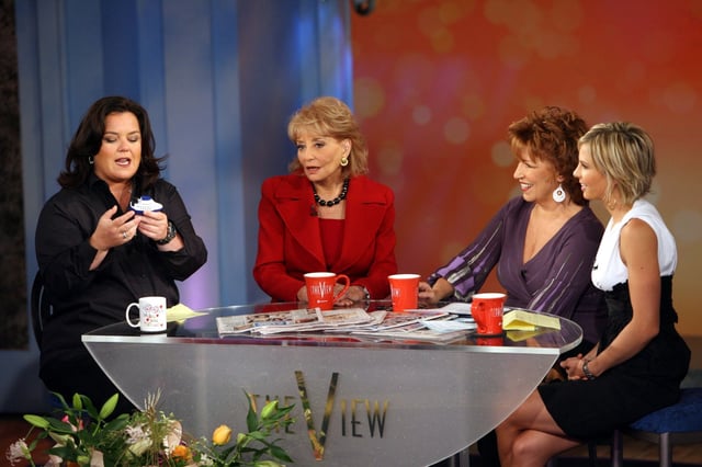 Rosie O&#39;Donnell, left,  gives away a cruise as she joins co-hosts Barbara Walters, second from left,  Joy Behar, second from right, and Elisabeth Hasselbeck during the taping of the first show of  the 10th season of the ABC talk show, The View,&#34; Tuesday, Sept. 5, 2006 in New York. (AP Photo/Mary Altaffer)