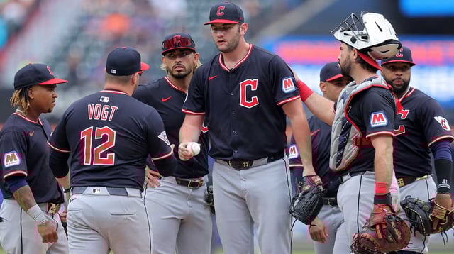 Aug 6, 2025; New York City, New York, USA; Cleveland Guardians manager Stephen Vogt (12) takes the ball from starting pitcher Gavin Williams (32) during a pitching change during the ninth inning against the New York Mets at Citi Field. Mandatory Credit: Brad Penner-Imagn Images