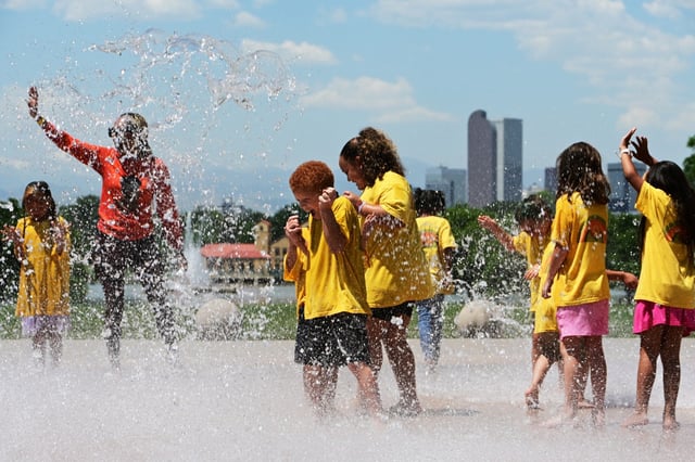 Children cool down in the H2Odyssey splash pad at City Park in Denver on Thursday, June 13, 2024. (Photo by Hyoung Chang/The Denver Post)
