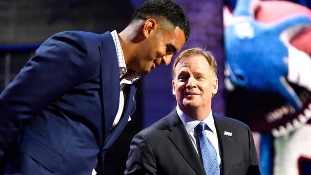 Titans quarterback Marcus Mariota stands on stage with NFL Commissioner Roger Goodell during the first round of the NFL Draft Thursday, April 25, 2019, in Nashville, Tenn.