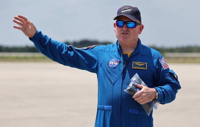 NASA astronaut Butch Wilmore waves to the media after arriving at Kennedy Space Center aboard T-38 aircraft, for the  Starliner Crew Flight Test, on Thursday, April 25, 2024. 

(Ricardo Ramirez Buxeda/ Orlando Sentinel)