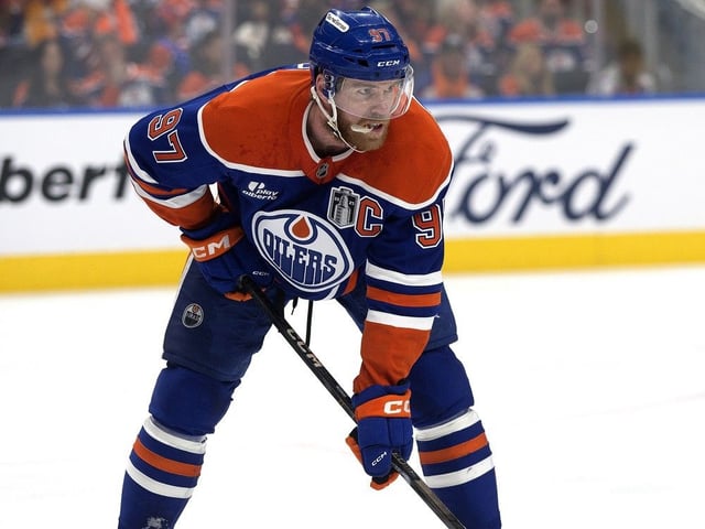 The Edmonton Oilers' Connor McDavid (97) battles the Florida Panthers during first period Stanley Cup Finals action at Rogers Place, in Edmonton Friday June 6, 2025.