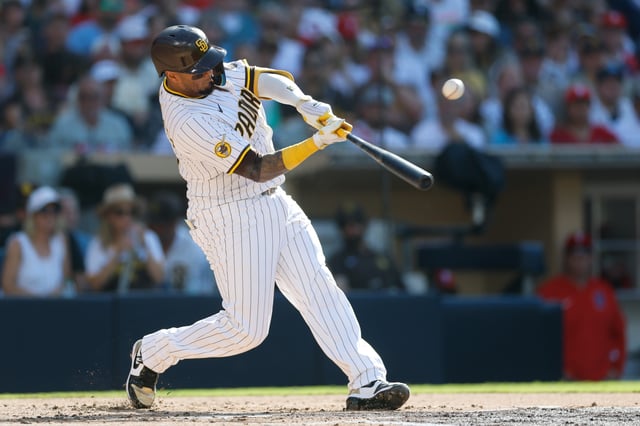 Jul 12, 2025; San Diego, California, USA; San Diego Padres catcher Martin Maldonado (15) hits a rbi single during the second inning against the Philadelphia Phillies at Petco Park. Mandatory Credit: David Frerker-Imagn Images/File Photo