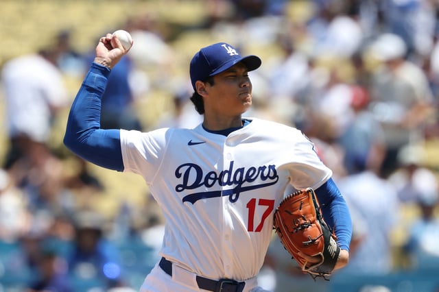 Aug 6, 2025; Los Angeles, California, USA; Los Angeles Dodgers two-way player Shohei Ohtani (17) pitches in the first inning against the St. Louis Cardinals at Dodger Stadium. Mandatory Credit: Kiyoshi Mio-Imagn Images