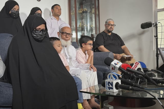 Det. Islam’s father Mohammed Abdur Rob spoke to reporters alongside Islam’s mother, his two sisters and young sons, ages 4 and 7. A portrait of Islam in uniform was displayed on a coffee table.