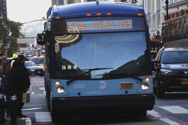 An MTA bus stops to pick up passengers on 34th Street in Herald Square on in 2023.