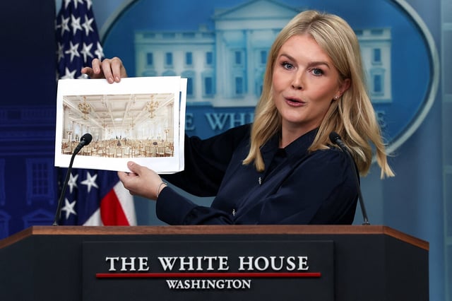 White House press secretary Karoline Leavitt holds a rendering of the new White House ballroom to be built, during a press briefing at the White House in Washington, July 31, 2025. 