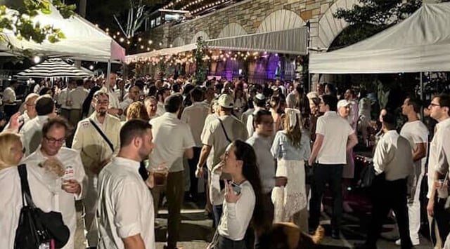 A crowd of Jewish singles, dressed in white, celebrate Tu B'Av at Bangitout's 2024 White Party (Courtesy of Bangitout)