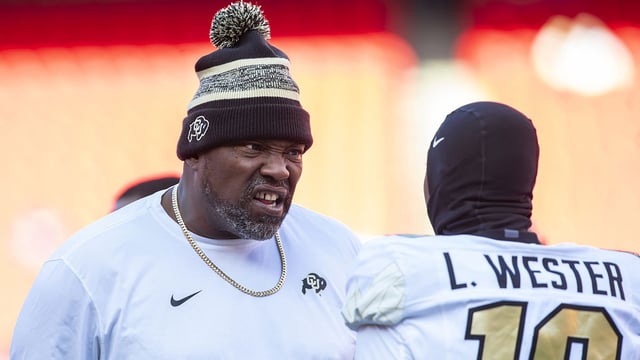 Colorado coach Warren Sapp motivates Colorado wide receiver LaJohntay Wester (10) prior to the game between the Kansas Jayhawks and the Colorado Buffaloes at GEHA Field at Arrowhead Stadium. Mandatory Credit: Nick Tre. Smith-Imagn Images