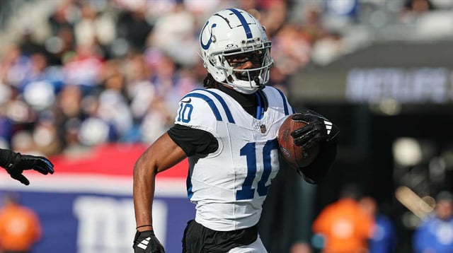 Dec 29, 2024; East Rutherford, New Jersey, USA; Indianapolis Colts wide receiver Adonai Mitchell (10) gains yards after catch during the first half against the New York Giants at MetLife Stadium. Mandatory Credit: Vincent Carchietta-Imagn Images