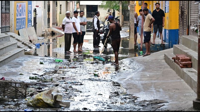 Residents in flood-hit areas of Prayagraj clean their homes and shops after water receded in several localities on Wednesday. (Anil Kumar Maurya/HT)