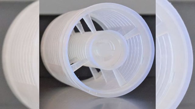 A detailed close-up of the Phase Gradient Ultra-Open Metamaterial (PGUOM) prototype, showcasing its open cylindrical structure with internal partitions. Designed for broadband acoustic silencing, this structure allows airflow while trapping unwanted sound through engineered phase shifts.