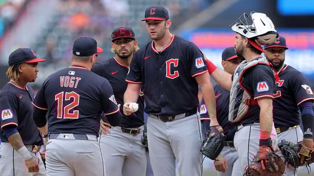 Aug 6, 2025; New York City, New York, USA; Cleveland Guardians manager Stephen Vogt (12) takes the ball from starting pitcher Gavin Williams (32) during a pitching change during the ninth inning against the New York Mets at Citi Field. Mandatory Credit: Brad Penner-Imagn Images