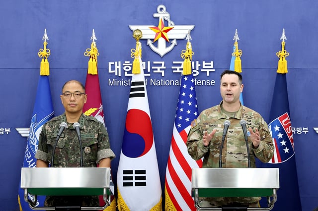SEOUL, SOUTH KOREA - AUGUST 07: (L to R) Col. Lee Sung-jun, public affairs director of South Korea's Joint Chiefs of Staff and Col. Ryan Donald, public affairs director of the United Nations Command (UNC), Combined Forces Command (CFC), and United States Forces Korea (USFK) attend the press briefing of Ulchi Freedom Shield 2025 exercise at the Defense Ministry on August 07, 2025 in Seoul, South Korea. The 11-day Freedom Shield is part of an annual combined training with troops from South Korea and the United States. Chung Sung-Jun/Pool via REUTERS