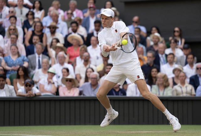 Jul 13, 2025; Wimbledon, United Kingdom; Jannik Sinner of Italy returns a shot during the menÕs singles final match against Carlos Alcaraz of Spain on day 14 at All England Lawn Tennis and Croquet Club. Mandatory Credit: Susan Mullane-Imagn Images/File Photo