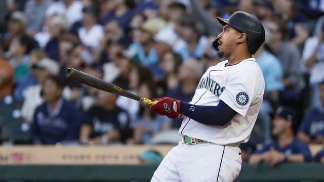 Aug 6, 2025; Seattle, Washington, USA; Seattle Mariners first baseman Josh Naylor (12) hits a two-run home run against the Seattle Mariners during the first inning at T-Mobile Park. Mandatory Credit: Joe Nicholson-Imagn Images