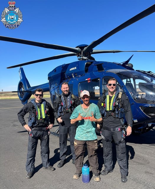 Kye Martin with the WA police helicopter team that rescued him on Sunday.