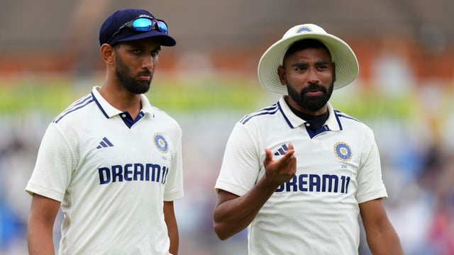 India's Mohammed Siraj, right, talks with Prasidh Krishna