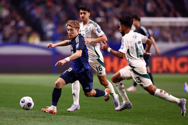 Soccer Football - World Cup - AFC Qualifiers - Third Round - Group A - Japan v Saudi Arabia - Saitama Stadium, Saitama, Japan - March 25, 2025 Japan's Ritsu Doan in action with Saudi Arabia's Nawaf Boushal and Faisel Al-Ghamdi REUTERS/Issei Kato/File Photo