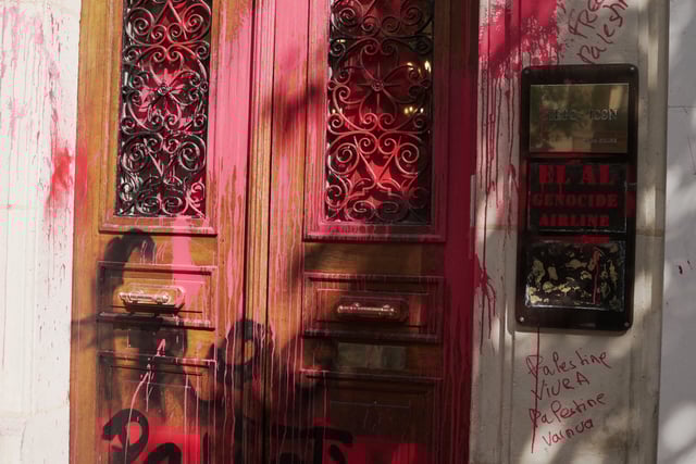 A view of a slogan 'EL AL genocide airline' sprayed with red paint on the entrance of the EL AL Israel Airlines offices in Paris, France August 7, 2025. REUTERS/Noemie Olive