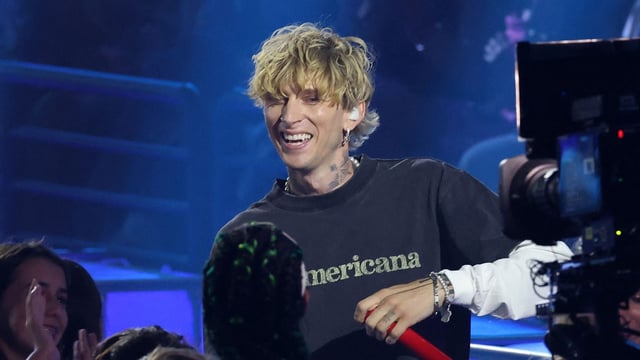 US rapper Machine Gun Kelly during a performance at the Nickelodeon Kids' Choice Awards. (Photo by VALERIE MACON / AFP)