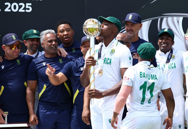 Cricket - 2025 ICC World Test Championship Final - South Africa v Australia - Lord's Cricket Ground, London, Britain - June 14, 2025 South Africa's Kagiso Rabada kisses the ICC Test Championship Mace as he celebrates on the podium with teammates after winning the final Action Images via Reuters/Andrew Boyers/File Photo