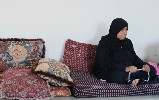 Khadra Hathaleen, mother of a Palestinian activist who witnesses say was shot by an Israeli settler, is seen in Umm al-Khair, West Bank, Monday, August 4, 2025, while on hunger strike to call for Israel to return his body.