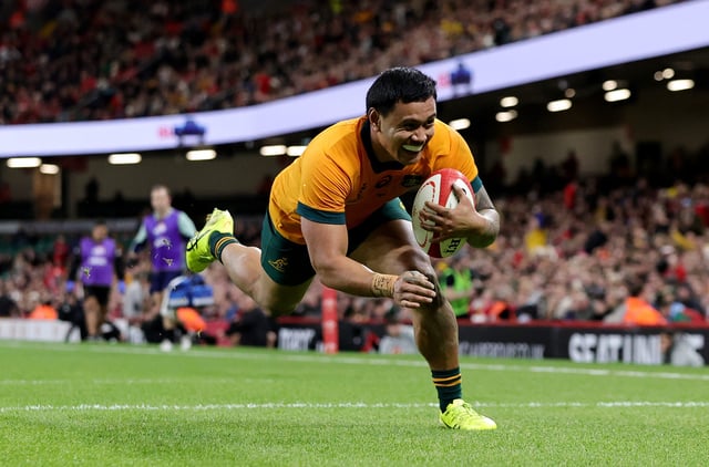 CARDIFF, WALES - NOVEMBER 17: Len Ikitau of Australia dives in to score his team's seventh try during the Autumn Nations Series 2024 match between Wales and Australia at the Principality Stadium on November 17, 2024 in Cardiff, Wales. (Photo by David Rogers/Getty Images)