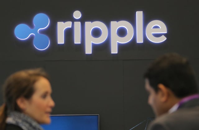 The logo of blockchain company Ripple is seen at the SIBOS banking and financial conference in Toronto, Ontario, Canada October 19, 2017. REUTERS/Chris Helgren/File Photo