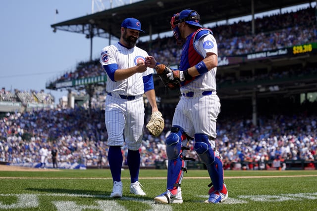 CHICAGO, ILLINOIS - AUGUST 6: Andrew Kittredge #59 of the Chicago Cubs celebrates with Carson Kelly #15 after pitching an immaculate inning in the top of the seventh inning of a game against the Cincinnati Reds at Wrigley Field on August 6, 2025 in Chicago, Illinois. (Photo by Matt Dirksen/Chicago Cubs/Getty Images)