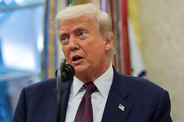 U.S. President Donald Trump speaks, as he and Apple CEO Tim Cook (not pictured) present Apple's announcement of a $100 billion investment in U.S. manufacturing, in the Oval Office at the White House in Washington, D.C., U.S., August 6, 2025. REUTERS/Jonathan Ernst