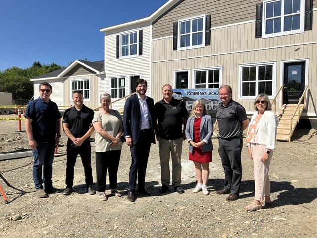 NB Housing Minister David Hickey, St. Stephen Mayor Allan MacEachern and Premier Susan Holt are seen Wednesday with representatives from Supreme Homes, Saint Croix MLA Kathy Bockus, Local Government Minister Aaron Kennedy, and St. Stephen deputy mayor Ghislaine Wheaton. 