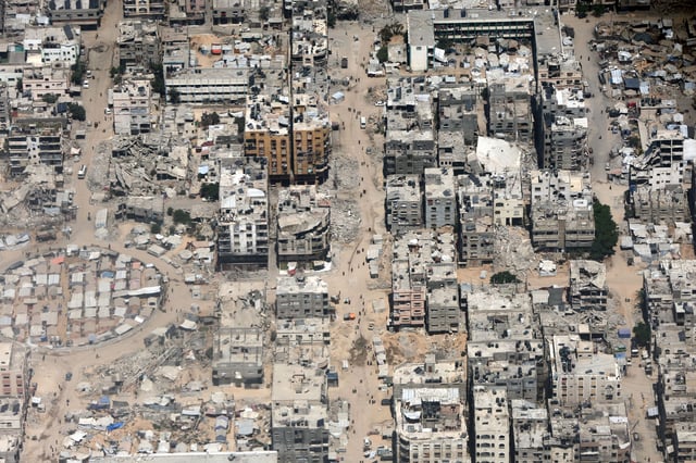 A view from the air as Jordanian air force personnel perform an air drop of aid and humanitarian supplies in Gaza on Wednesday.
