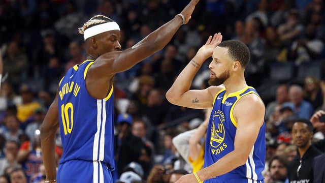 Apr 1, 2025; Memphis, Tennessee, USA; Golden State Warriors forward Jimmy Butler III (10) reacts with guard Stephen Curry (30) during the fourth quarter against the Memphis Grizzlies at FedExForum. Mandatory Credit: Petre Thomas-Imagn Images