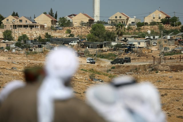Palestinians say Israel tried to prevent mourners from reaching activist Awdah Hathaleen's funeral
