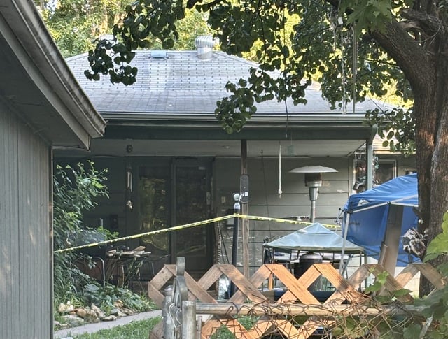 Topeka police investigating a homicide reported late Aug. 6 had yellow crime scene tape up the following morning behind a house at 124 NW Kendall Ave.