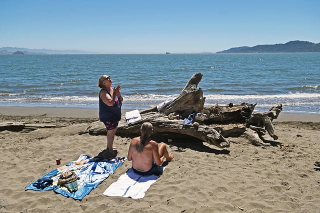Susan Callahan and Mel Massucco of Worcester, Massachusetts sunbathe at San Quentin Beach on Monday, Aug. 4, 2025. (Alan Dep/Marin Independent Journal)