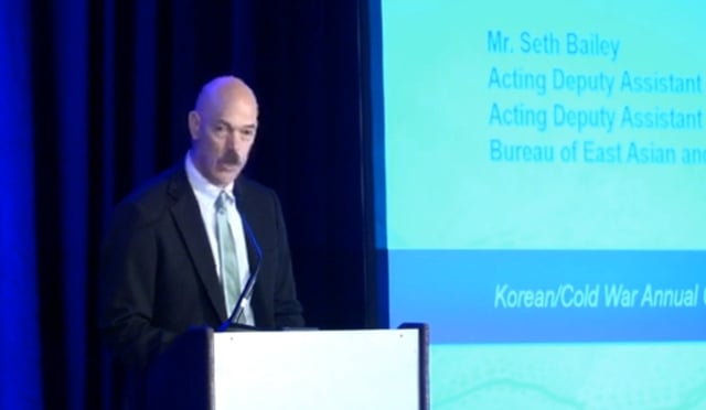 Seth Bailey, acting deputy assistant secretary in the State Department's Bureau of East Asian and Pacific Affairs, speaks during an event hosted by the Defense POW/MIA Accounting Agency (DPAA) in Arlington, Virginia, on Aug. 7, 2025 in this photo captured from a YouTube account of Defense Now. (PHOTO NOT FOR SALE) (Yonhap)