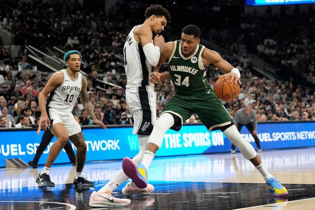 Jan 31, 2025; San Antonio, Texas, USA; Milwaukee Bucks forward Giannis Antetokounmpo (34) drives to the basket against San Antonio Spurs center Victor Wembanyama (1) during the second half at Frost Bank Center. Mandatory Credit: Scott Wachter-Imagn Images