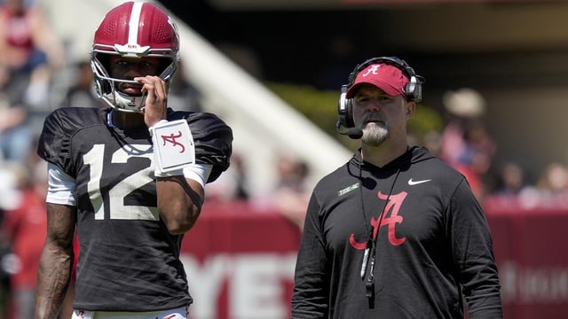 Apr 12, 2025; Tuscaloosa, AL, USA; Alabama quarterback Keelon Russell (12) stands with Alabama offensive coordinator Ryan Grubb during A-Day drills at Bryant-Denny Stadium. Mandatory Credit: Gary Cosby/USA TODAY NETWORK via Imagn Images