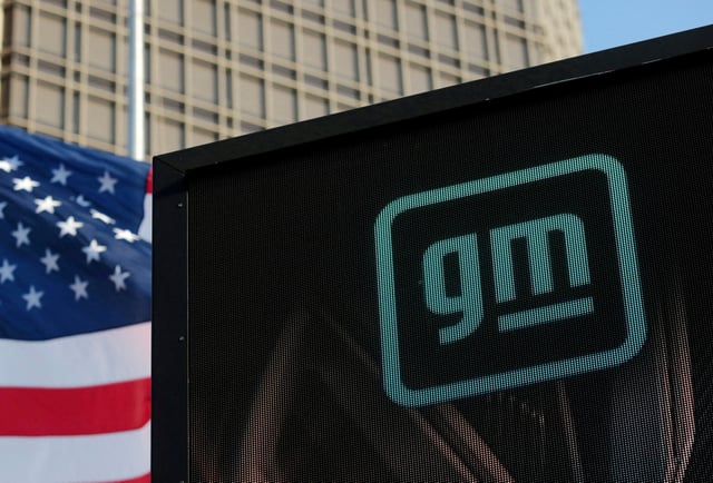 The new GM logo is seen on the facade of the General Motors headquarters in Detroit, Michigan, U.S., March 16, 2021. Picture taken March 16, 2021.  REUTERS/Rebecca Cook/File Photo